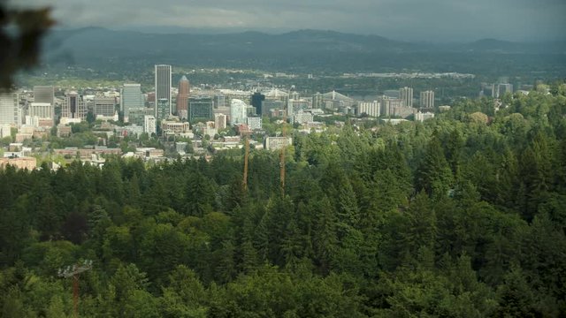 A slow motion panning shot of the view from Pittock Mansion in the hills of Portland Oregon on a cloudy day.