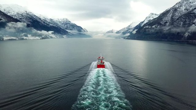 Tanker splits tranquil frozen waters in an icy northern inlet