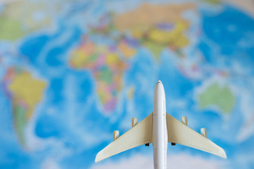 Fototapeta na wymiar The model plane on background map. travel, tourism, air travel