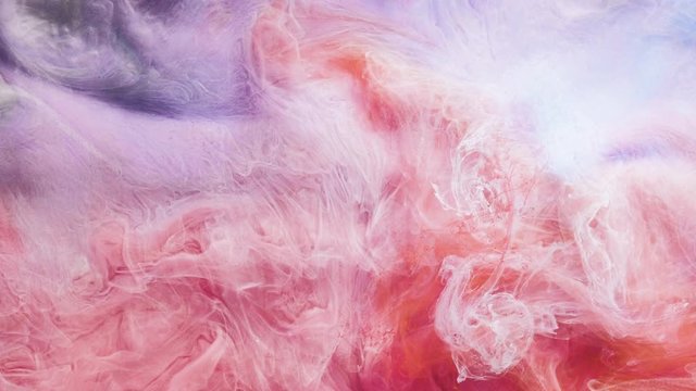 Mixed inks cloud motion. Abstract paints animation in water. Colorful smoke fusion