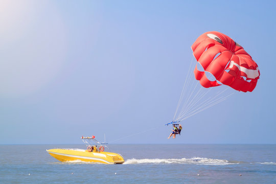 Parasailing - active form of recreation, in which person is fixed with long rope to moving boat and thanks to presence of special parachute hovers through air