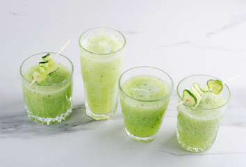 Several glasses of green organic smoothie.Organic and healthy drink
