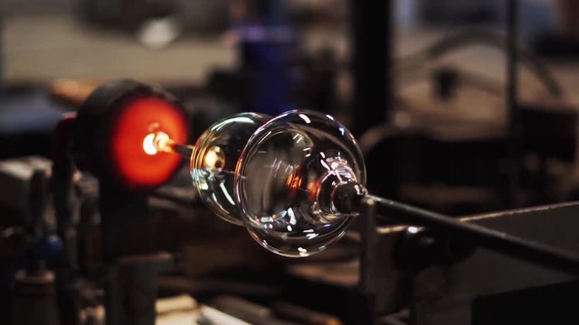 noble wine glass is manufactured in a glassworks by hand