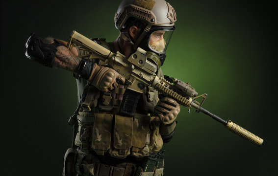 The guy in protective clothing and a black mask with a sniper rifle