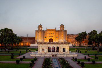 Iconic Alamigiri Gate of the Fort at sunset, Lahore, Pakistan in the sunset time with a pavilion in...