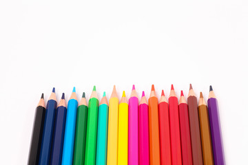 set of colored pencils on a white background