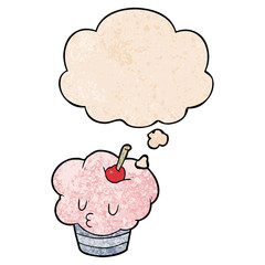 cartoon cupcake and thought bubble in grunge texture pattern style