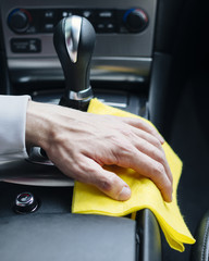 Close up of person cleaning car interior