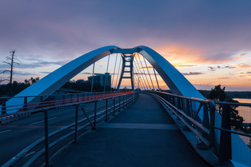 light trails on bridge at sunset
