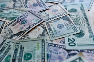 business, finance, investment, saving and corruption concept - money background from dollars usa.