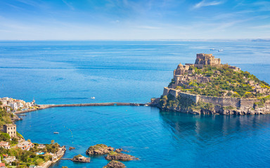 Aerial view of Aragonese Castle located in sea near Ischia island, Italy.