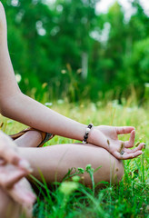 Yoga meditation in park. woman's hand to meditate outdoor.