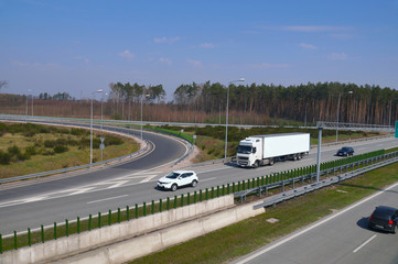 Various cars moving on the highway. Motorway node.