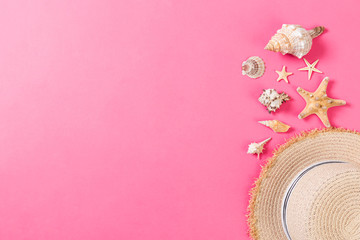 summer holiday beach background with accessories on pink table, top view with copy space. vacation concept