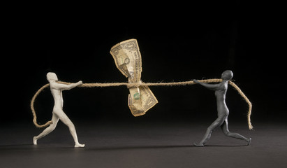 Guys strangle a dollar with a rope. Concept of monetary tension and recession on the dollar....