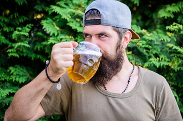 Quench thirst. Hipster brutal bearded man hold mug cold fresh beer. Alcohol drink and bar. Craft...