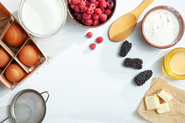 Food background top view. Mock up with ingredients for cooking pie or pancake on white background. Horizontal. Summer berry. Various cooking ingredients with copy space frame. Flat lay