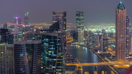 Aerial skyline of Dubai's business bay with skyscrapers day to night timelapse