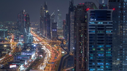 Fototapeta na wymiar Aerial view to skyscrapers on Dubai downtown and Sheikh Zayed road night timelapse, Dubai, United Arab Emirates
