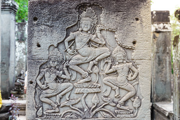 Famous bas reflief carved in the wall of Angkor Wat temple, world heritage and most visited tourist site, Cambodia. Details, close up of dancing damsels, apsara.