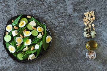 Healthy food. Dietary salad with spinach, quail eggs and nuts. Keto diet. Keto Salad