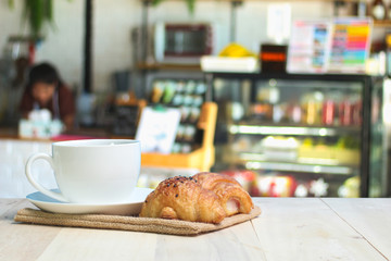 Croissant and coffee   on wood table