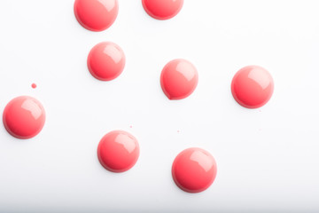 A cluster of red drops isolated on a white background. 