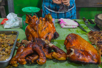 Street food in Luang Prabang, Laos. Delicious food stall selling sticks of grilled meat to tourist. Asian cuisine, tasty food, healthy lifestyle.