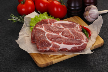 Raw pork neck steak