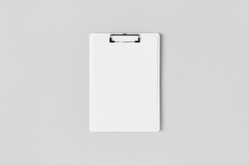 White clipboard mockup with a blank paper. Top view.