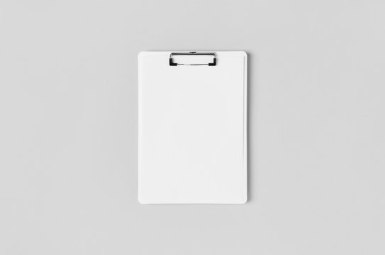 White clipboard mockup with a blank paper. Top view.
