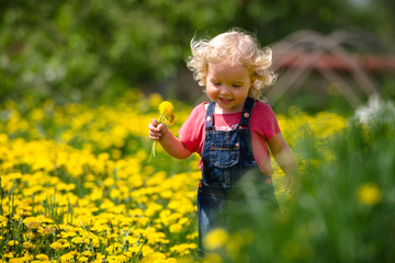 girl walking in a clearing among the flowers