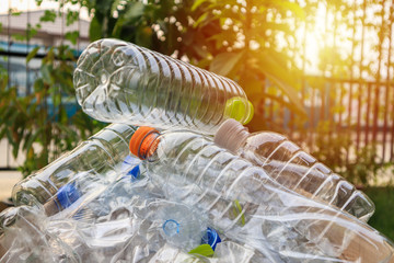 plastic bottles in brown recycle garbage box
