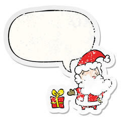 cartoon santa claus and present and speech bubble distressed sticker