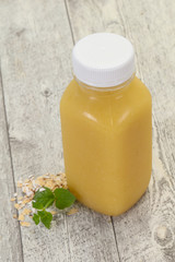 Dietary vegetarian oats milk over wooden