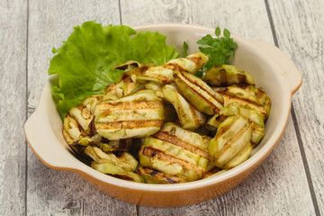 Grilled eggplant slices served basil