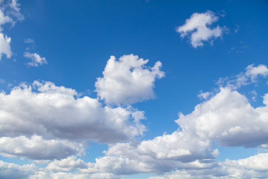 Clouds against blue sky as background © schankz