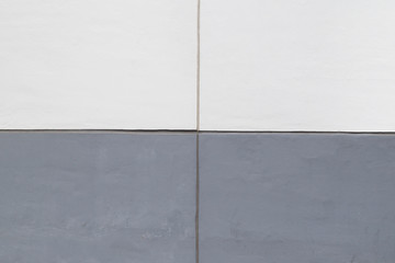 High resolution full frame background of a concrete wall painted in white and gray, 2x2 grid.