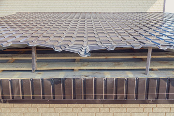 Installation of metal drain on the roof of the house