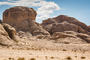 Fototapeta premium Desert with sandstone and granite rock in shape of boat in Wadi Rum in Jordan