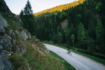 evening on road bicycle in mountains