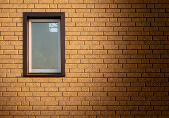 Fototapeta na wymiar A window in a house with brick walls