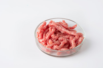 Minced meat in glass Petri dish for laboratory studies. Close up. Space for text. Chemical experiment.