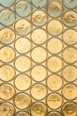 A stained glass background, old church window with stained glass, opaque yellow circles