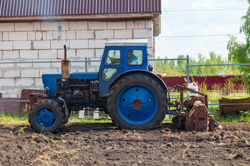 Tractor plowing soil in spring