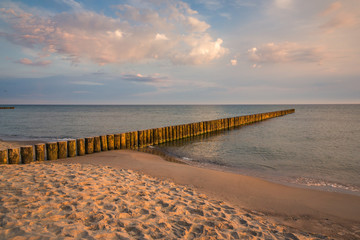 Breakwater at Baltic sea at sunny day in Trzesacz, Poland