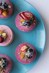 Fototapeta na wymiar Vegan raw desserts, cakes and candies. Love for a healthy vegan food concept