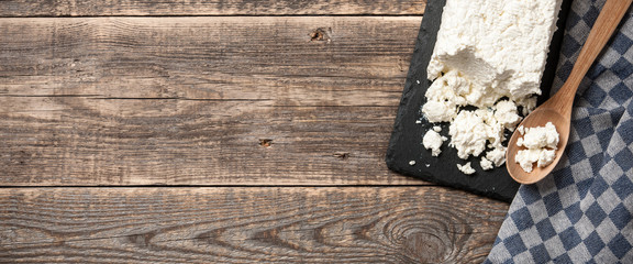 Obraz na płótnie Canvas Homemade cottage cheese on wooden table