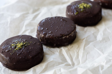 Raw vegan cookie on the plate. Close up