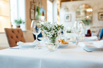 Festive wedding table setting. Empty wine glasses